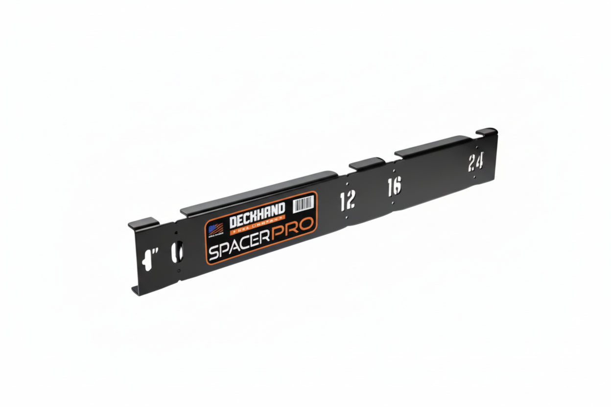 Black metal spacer bar with measurement markings on a white background